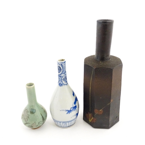 389 - A Japanese studio pottery vase with octagonal body, elongated neck and brushwork detail. Together wi... 