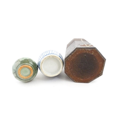 389 - A Japanese studio pottery vase with octagonal body, elongated neck and brushwork detail. Together wi... 