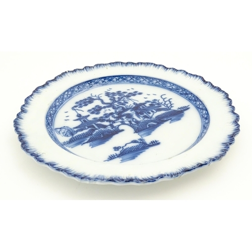 392 - A Liverpool blue and white pearlware plate with feathered edge decorated with chinoiserie detail dep... 