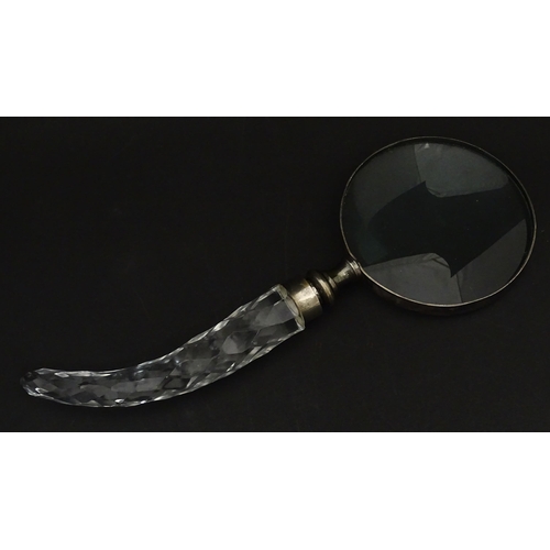 402 - A 20thC magnifying glass with cut glass handle. Approx. 10 3/4