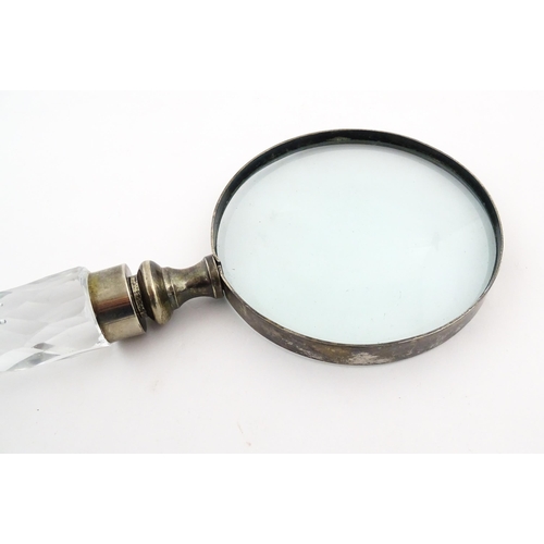 402 - A 20thC magnifying glass with cut glass handle. Approx. 10 3/4