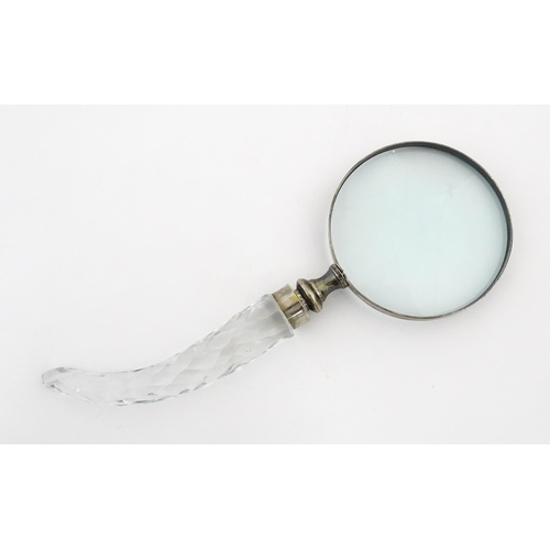 402 - A 20thC magnifying glass with cut glass handle. Approx. 10 3/4