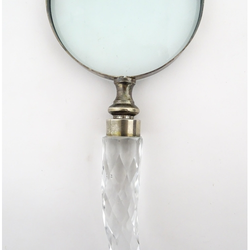 402 - A 20thC magnifying glass with cut glass handle. Approx. 10 3/4