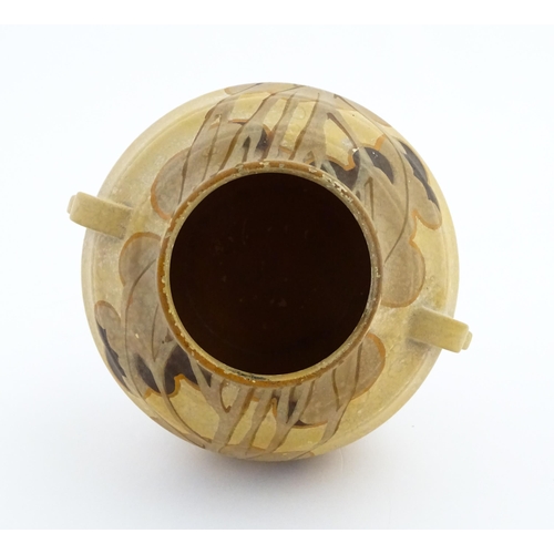 413 - An Art Deco vase of globular form with twin handles decorated with trees in a landscape. Marked Engl... 