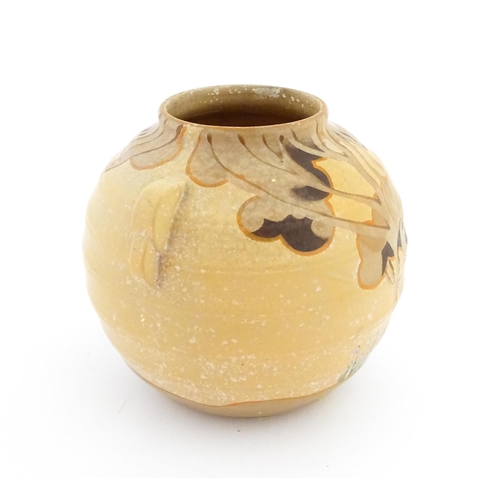 413 - An Art Deco vase of globular form with twin handles decorated with trees in a landscape. Marked Engl... 