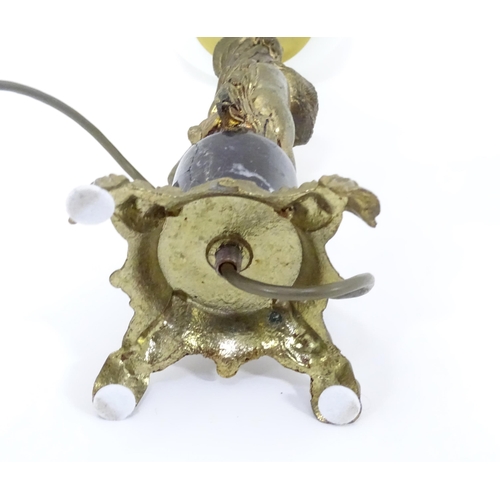 416 - A 20thC cast table lamp with cherub detail to column. Approx. 18 1/2