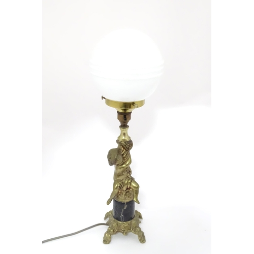 416 - A 20thC cast table lamp with cherub detail to column. Approx. 18 1/2