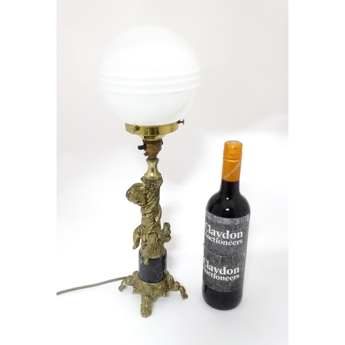 416 - A 20thC cast table lamp with cherub detail to column. Approx. 18 1/2