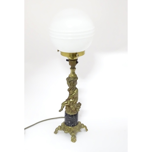 416 - A 20thC cast table lamp with cherub detail to column. Approx. 18 1/2