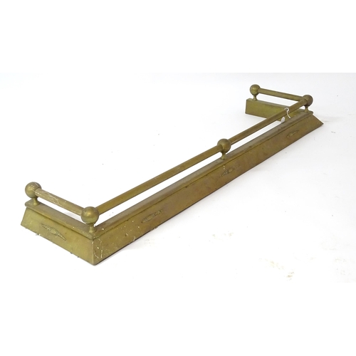 609 - A brass fire fender, with swag style detail, approx 54