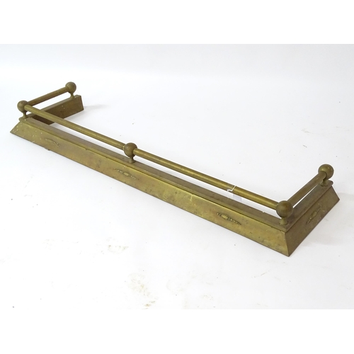 609 - A brass fire fender, with swag style detail, approx 54