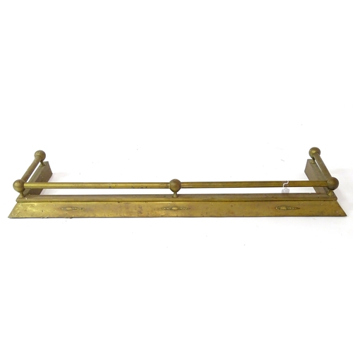 609 - A brass fire fender, with swag style detail, approx 54