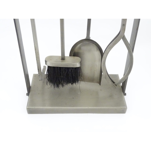 616 - A fireside companion set comprising poker, tongs, brush and shovel. Approx. 31 1/4