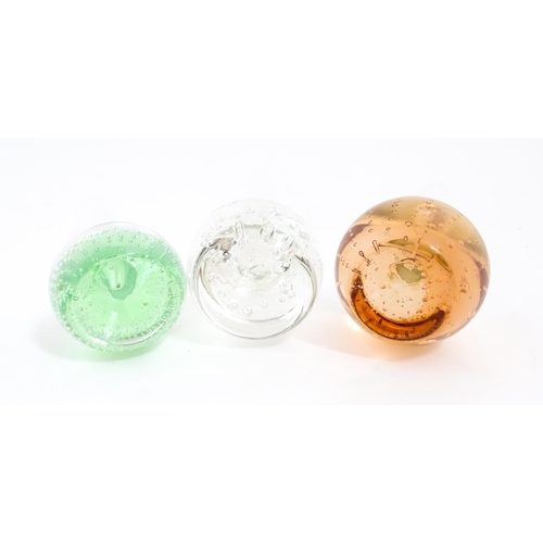 618 - A quantity of assorted art glass paperweights and vases, to include bud vases and a Murano style gla... 