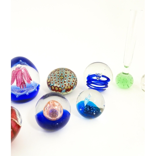618 - A quantity of assorted art glass paperweights and vases, to include bud vases and a Murano style gla... 