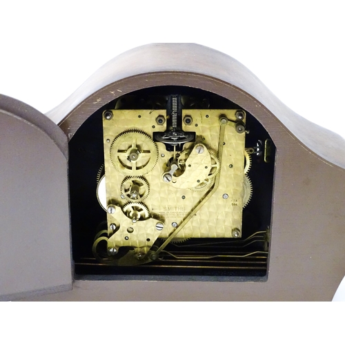 620 - A 20thC smiths walnut cased mantle clock with chiming movement.  Approx. 8