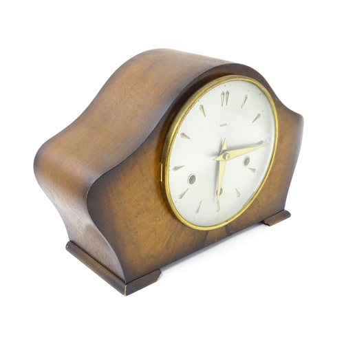 620 - A 20thC smiths walnut cased mantle clock with chiming movement.  Approx. 8