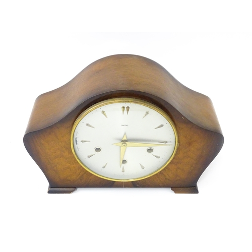 620 - A 20thC smiths walnut cased mantle clock with chiming movement.  Approx. 8