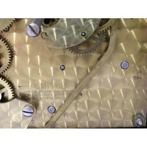 620 - A 20thC smiths walnut cased mantle clock with chiming movement.  Approx. 8