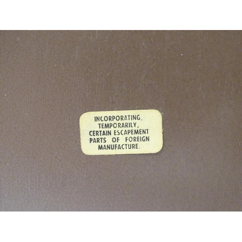 620 - A 20thC smiths walnut cased mantle clock with chiming movement.  Approx. 8