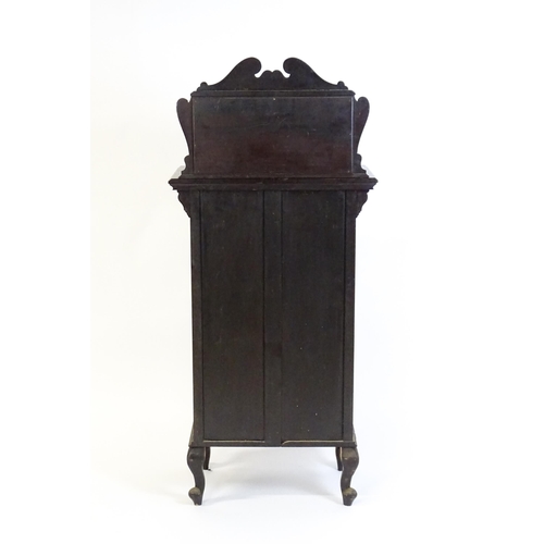 627 - A late Victorian ebonised side cabinet with a mirrored upstand, a moulded top and a single frieze dr... 