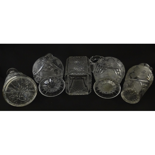 628 - A quantity of assorted cut glass decanters, claret jugs, etc. Largest approx. 11 1/4