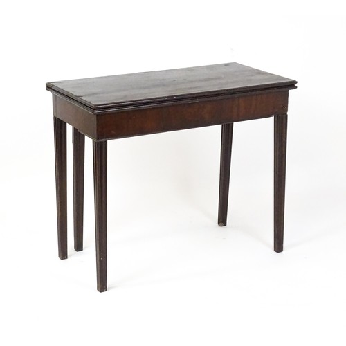 630 - An 18thC mahogany tea table raised on five chamfered tapered legs. 36