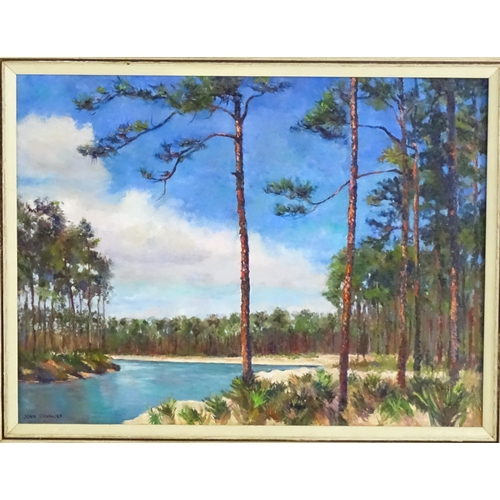 650 - Joan Cavalier, 20th century, Oil on canvas, A lake scene bordered by pine trees. Signed lower left. ... 