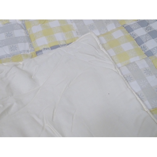 657 - A pair of curtains decorated in a yellow and white check pattern with bow detail. Together with a ma... 