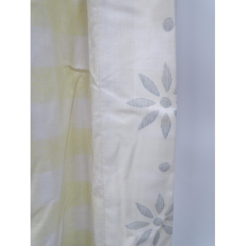 657 - A pair of curtains decorated in a yellow and white check pattern with bow detail. Together with a ma... 