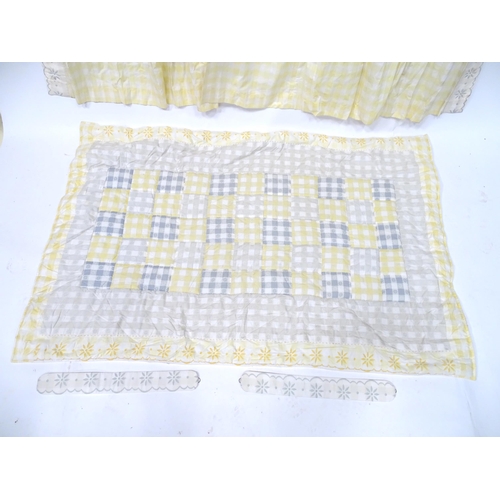 657 - A pair of curtains decorated in a yellow and white check pattern with bow detail. Together with a ma... 