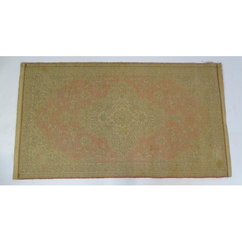 698 - Carpet / Rug : A red ground red decorated with a central vignette with floral and foliate detail. Ap... 