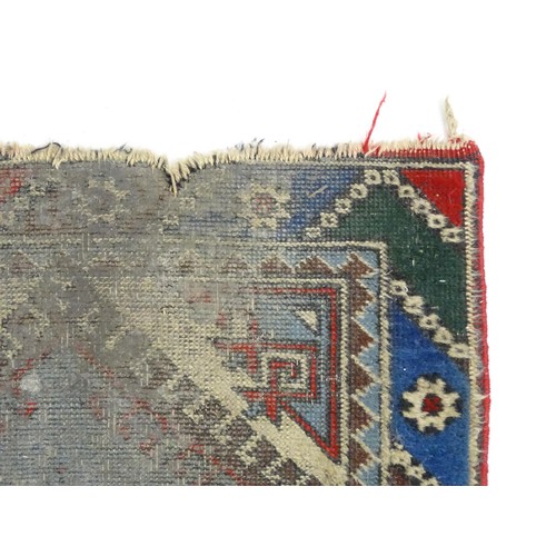 699 - Carpet / Rug : A pale blue ground runner decorated with repeating geometric motifs and banded border... 