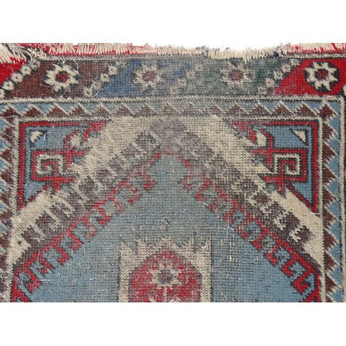 699 - Carpet / Rug : A pale blue ground runner decorated with repeating geometric motifs and banded border... 