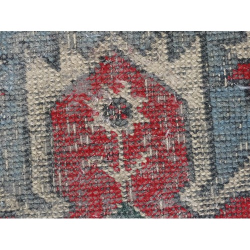 699 - Carpet / Rug : A pale blue ground runner decorated with repeating geometric motifs and banded border... 