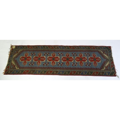 699 - Carpet / Rug : A pale blue ground runner decorated with repeating geometric motifs and banded border... 
