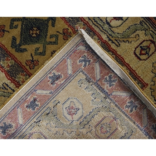 706 - Carpet / Rug  : Two runners with banded motifs to the central ochre coloured ground bordered by flor... 