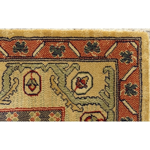 706 - Carpet / Rug  : Two runners with banded motifs to the central ochre coloured ground bordered by flor... 