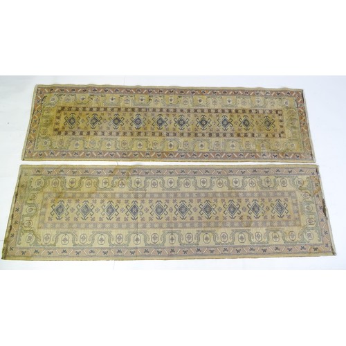 706 - Carpet / Rug  : Two runners with banded motifs to the central ochre coloured ground bordered by flor... 