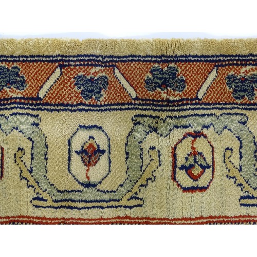 706 - Carpet / Rug  : Two runners with banded motifs to the central ochre coloured ground bordered by flor... 
