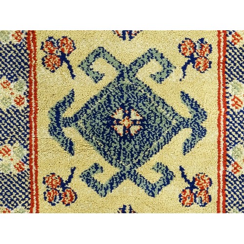706 - Carpet / Rug  : Two runners with banded motifs to the central ochre coloured ground bordered by flor... 