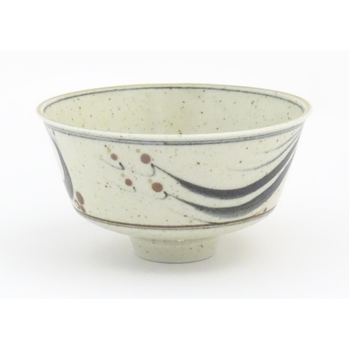 709 - A studio pottery footed bowl with brushwork detail by Derek Clarkson (1928-2013). Makers mark to foo... 