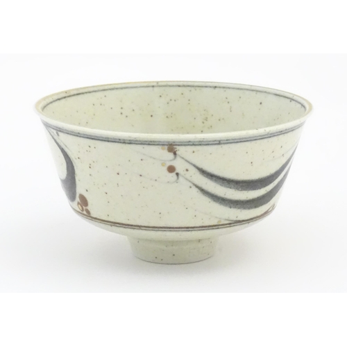 709 - A studio pottery footed bowl with brushwork detail by Derek Clarkson (1928-2013). Makers mark to foo... 