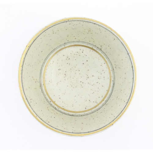 709 - A studio pottery footed bowl with brushwork detail by Derek Clarkson (1928-2013). Makers mark to foo... 