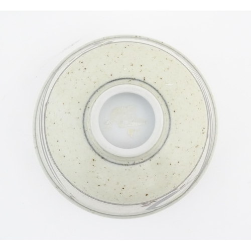 709 - A studio pottery footed bowl with brushwork detail by Derek Clarkson (1928-2013). Makers mark to foo... 