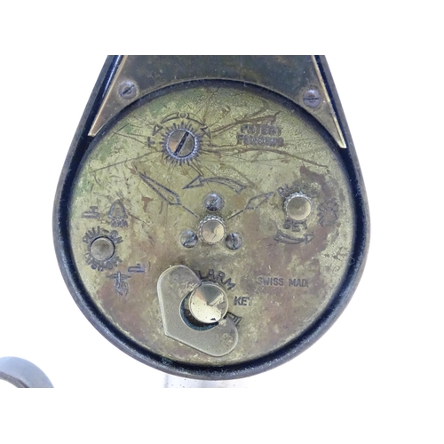 711 - A Swiza novelty clock formed as a chamber stick with candle, the clock of flame form.  Approx 5 1/4