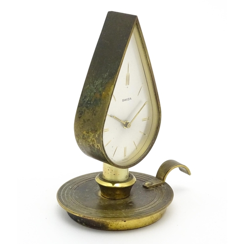 711 - A Swiza novelty clock formed as a chamber stick with candle, the clock of flame form.  Approx 5 1/4