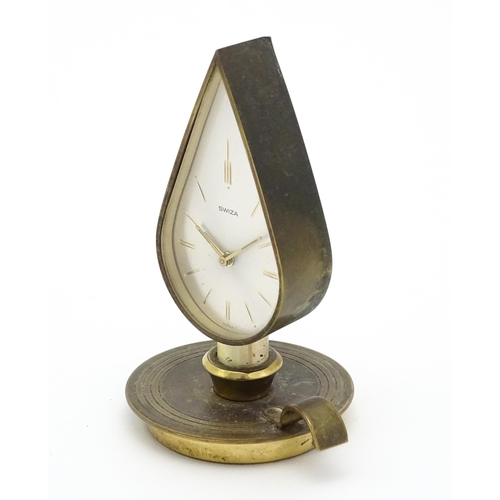 711 - A Swiza novelty clock formed as a chamber stick with candle, the clock of flame form.  Approx 5 1/4