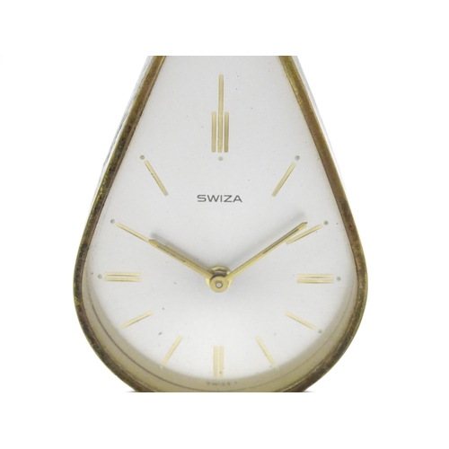 711 - A Swiza novelty clock formed as a chamber stick with candle, the clock of flame form.  Approx 5 1/4