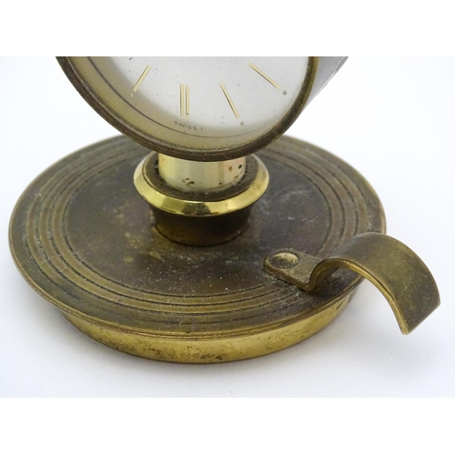 711 - A Swiza novelty clock formed as a chamber stick with candle, the clock of flame form.  Approx 5 1/4